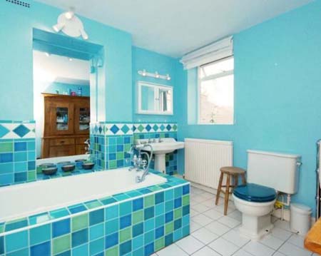 Blue bathroom with bathtub